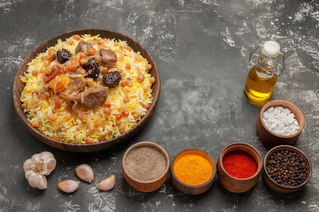 rice pilaf with meat colorful spices garlic bottle of oil