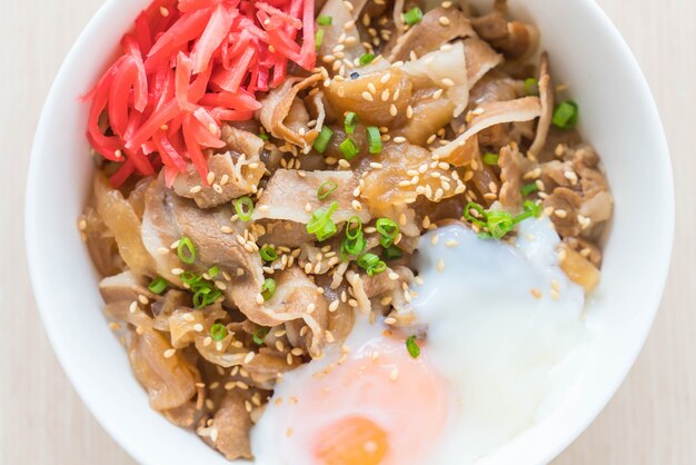 rice topped with slice pork and onsen egg