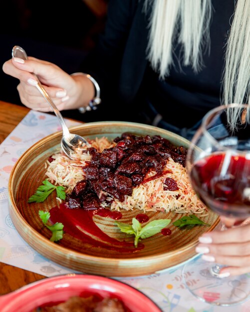 Rice with meat in red sauce mint side view