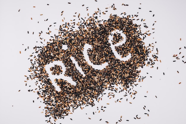 Rice writing in heap of black grains