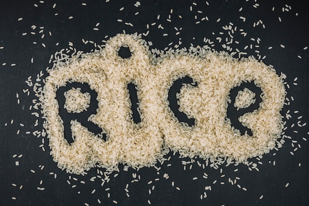 Free photo rice writing in heap of grains