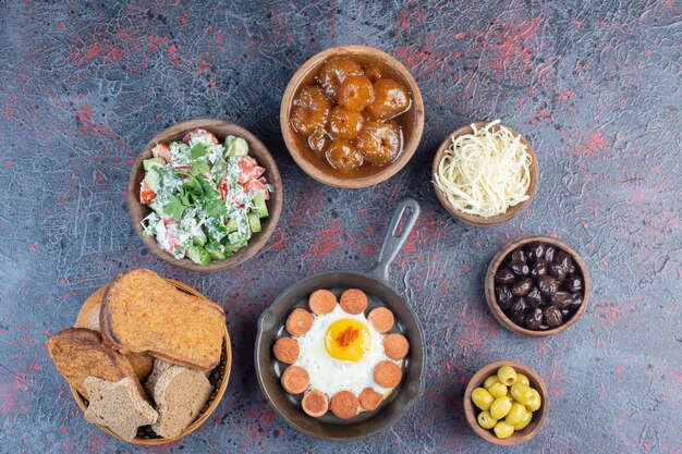 Rich breakfast table with variety of ingredients. 