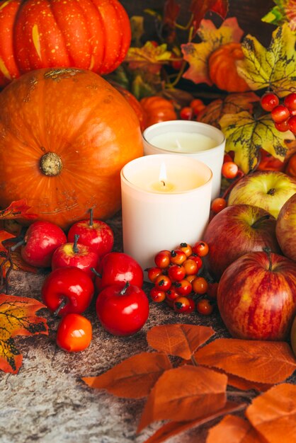 Rich harvest and candles on table