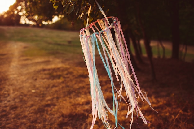 Free photo ring with ribbons hangs on the wind