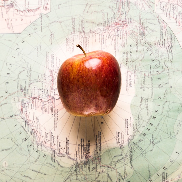 Ripe apple on map