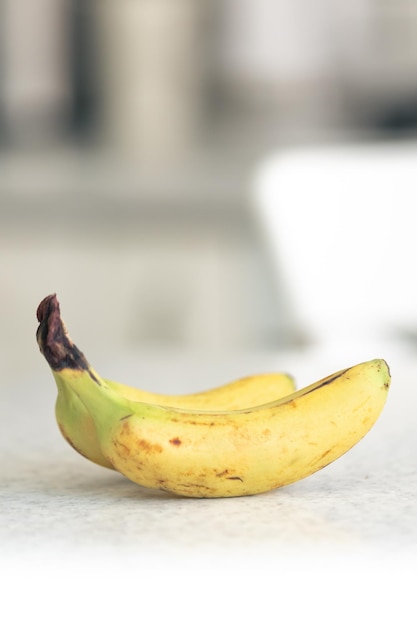 Free photo ripe bananas on a blurred light background