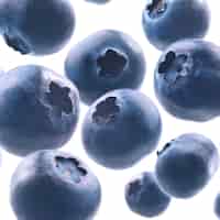 Free photo ripe blueberries levitate on a white background