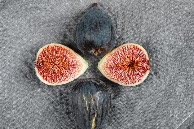 Ripe delicious figs on grey tablecloth