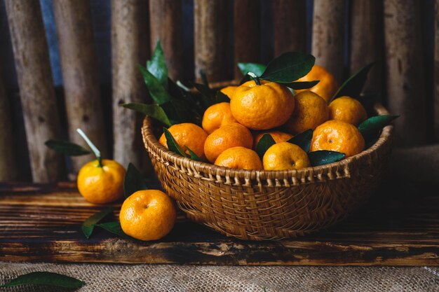 Ripe orange mandarins in a bowl on the table