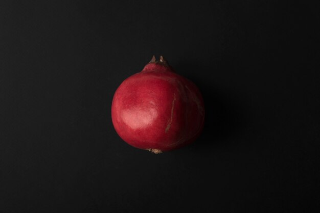 Ripe pomegranate isolated over black