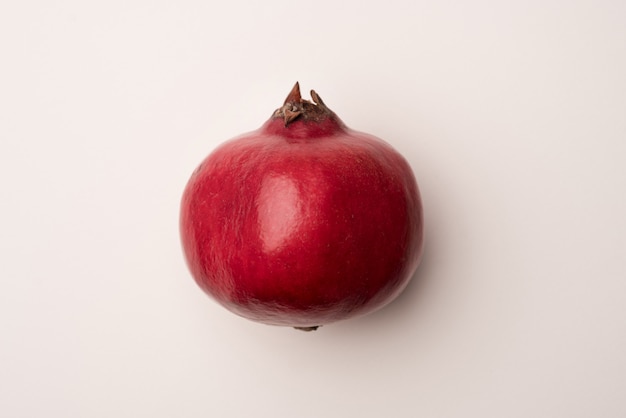 Ripe pomegranate isolated over white