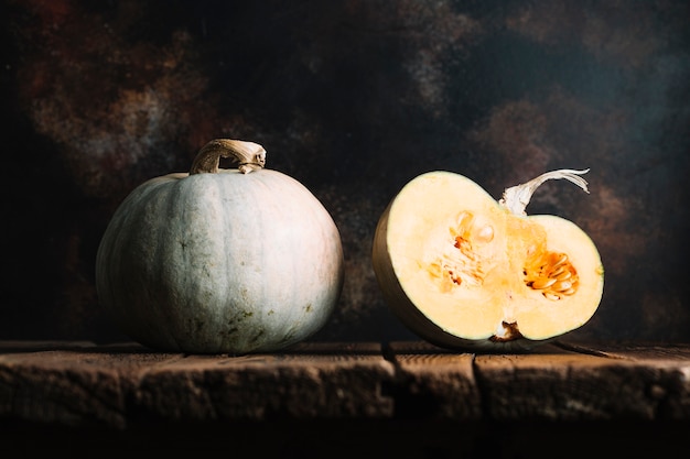 Ripe pumpkins on a wooden table