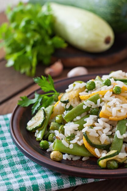 Risotto with asparagus beans, zucchini and green peas