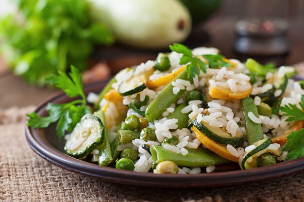 Risotto with asparagus beans, zucchini and green peas