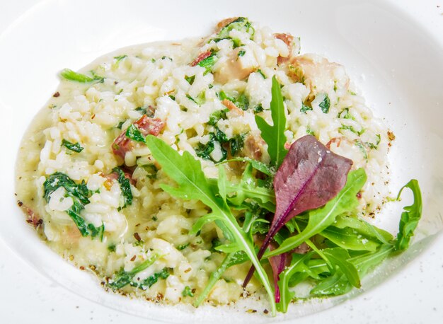 Risotto with smoked meat, spinach, parmesan cheese
