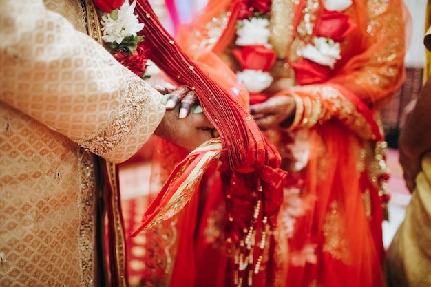 Free photo ritual with coconut leaves during traditional hindu wedding ceremony