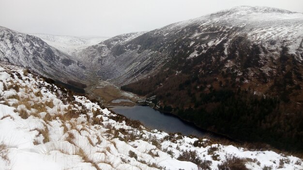 River flowing through the mountain covered in snow