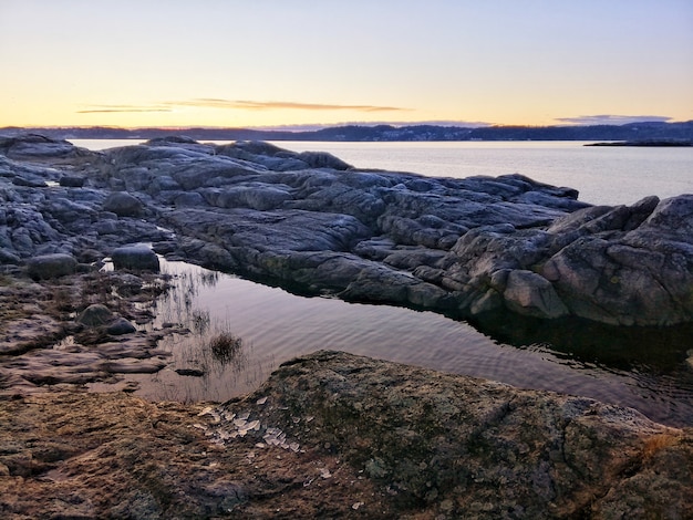 river during a mesmerizing sunset in Ostre Halsen, Norway