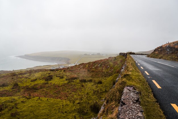 Road near the coast on a cloudy day