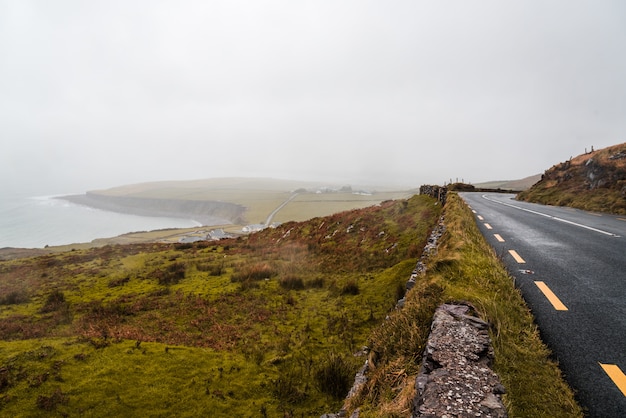 Road near the coast on a cloudy day