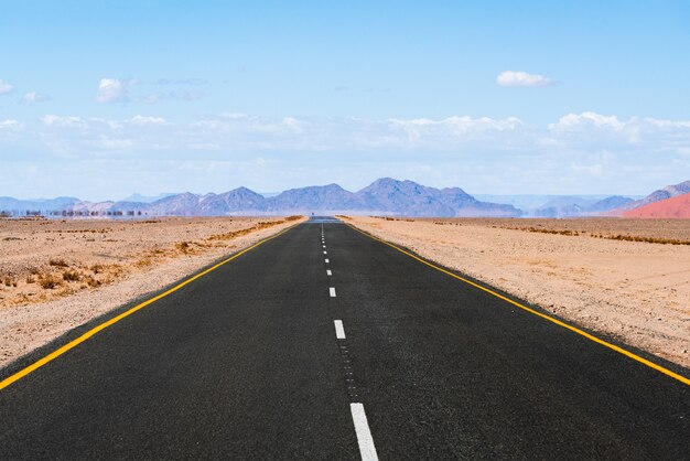 Road way to Spitzkoppe mountains. The Spitzkoppe, is a group of bald granite peaks located in Swakopmund Namib desert - namibia