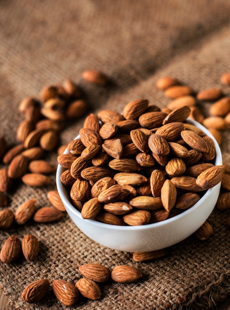 Free photo roasted almonds in a white bowl