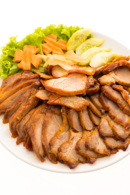 Free photo roasted bbq red pork with sweet sauce in chinese food style in white plate