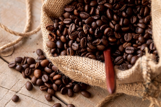 Roasted coffee beans in burlap sack