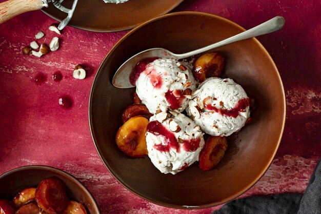 Roasted plums ice cream bowl with spoon