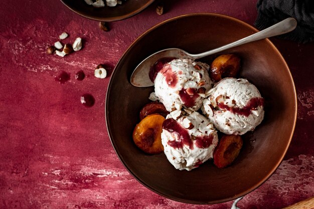 Roasted plums ice cream with chopped hazelnut