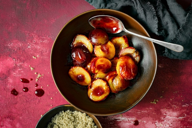 Free photo roasted plums with brown sugar top view