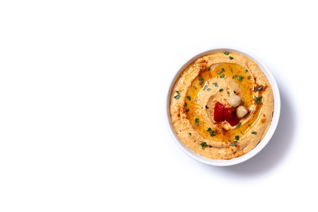 Free photo roasted red pepper hummus in white bowl isolated on white background