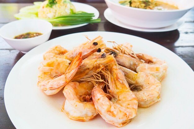 Roasted shrimp served in white dish ready to eat