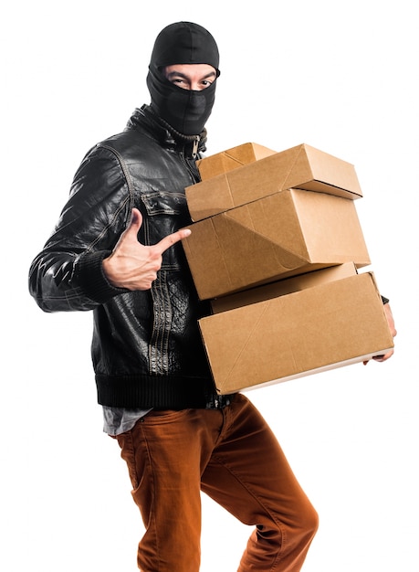 Free photo robber holding boxes