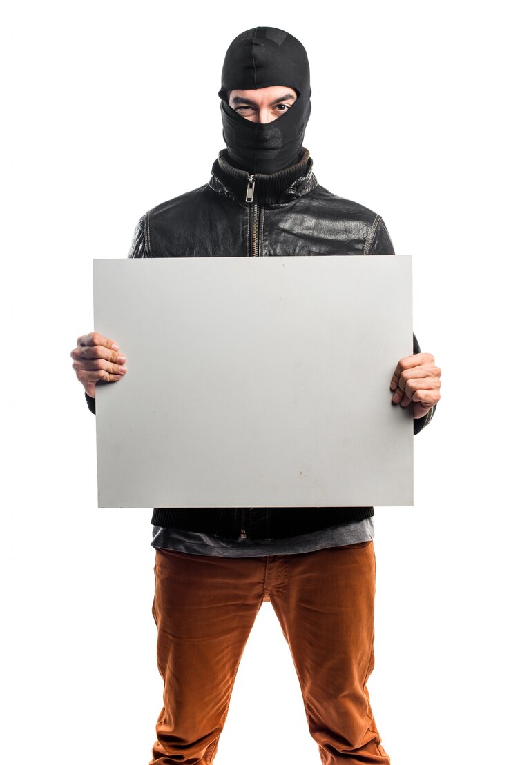 Free Photo robber holding an empty placard