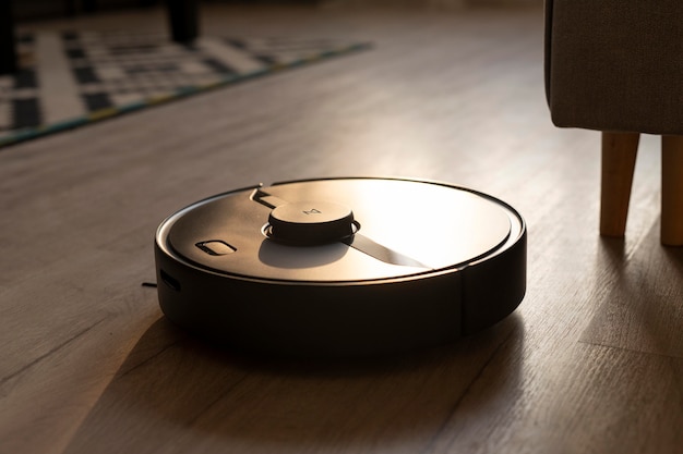 Free photo robot vacuum doing its work in the house