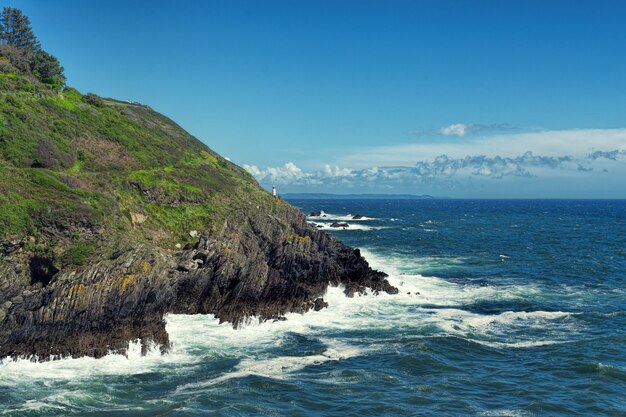 Rock formation beside blue sea