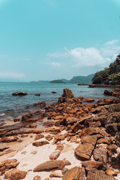 Rock formations on the beach in Rio on a sunny day