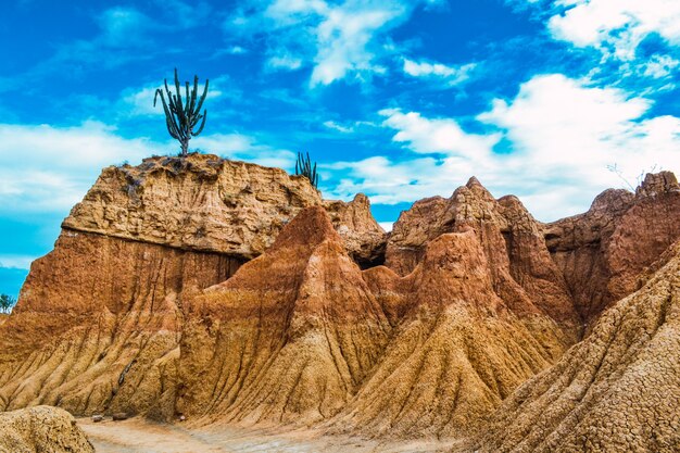 Rocks under the cloudy blue sky in the Tatacoa Desert, Colombia