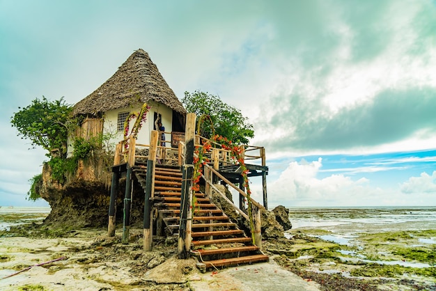 The Rocks restaurant on the beach during low tide. Pingwe, Zanzibar, Tanzania