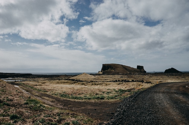 Free photo rocky landscape with a lot of bushes under a cloudy sky