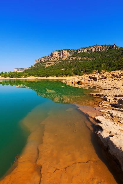 Rocky landscape with mountains lake.