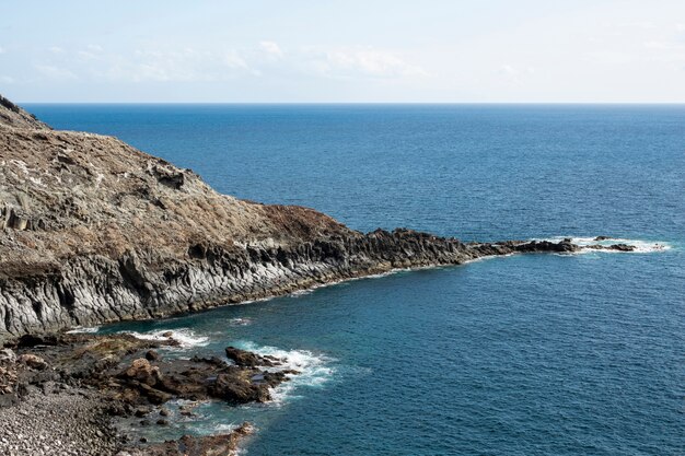 Rocky ocean littoral with clear sky