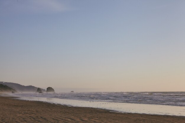 Rocky shoreline of the Pacific Ocean at Cannon Beach, Oregon, USA