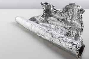 Free photo roll of aluminum foil isolated on white background