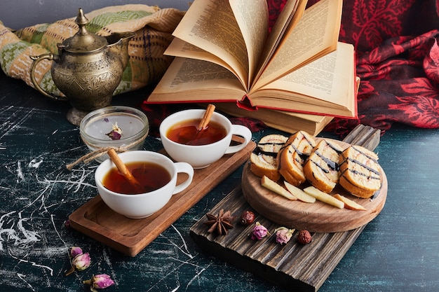 Roll cake slices with a cup of herbal tea. 