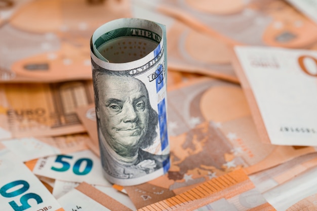 roll of money on banknote table close-up.