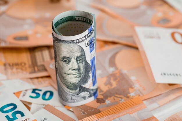 roll of money on banknote table close-up.