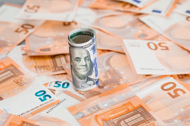 roll of money on grey and banknote table .