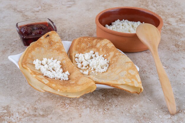 Roll pancakes with cottage cheese and milk